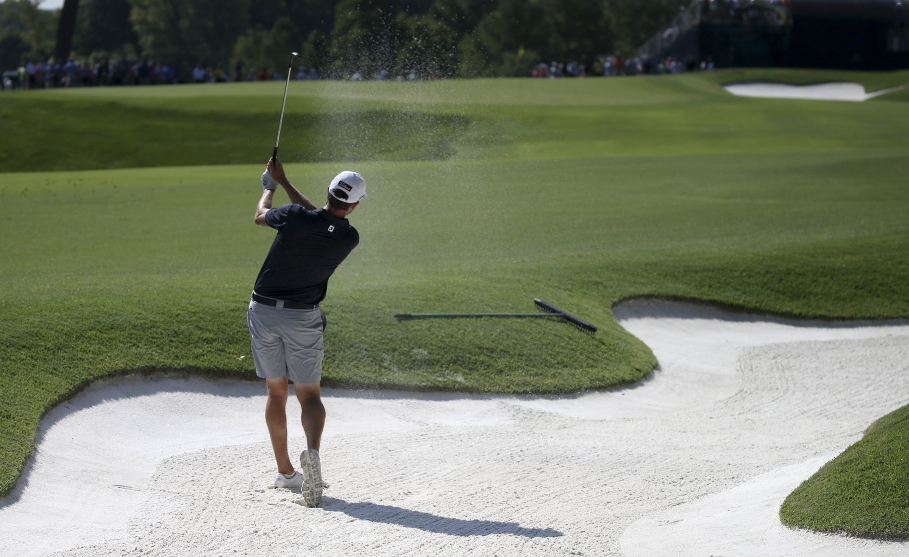 Jimmy Walker hits out of a sand trap
